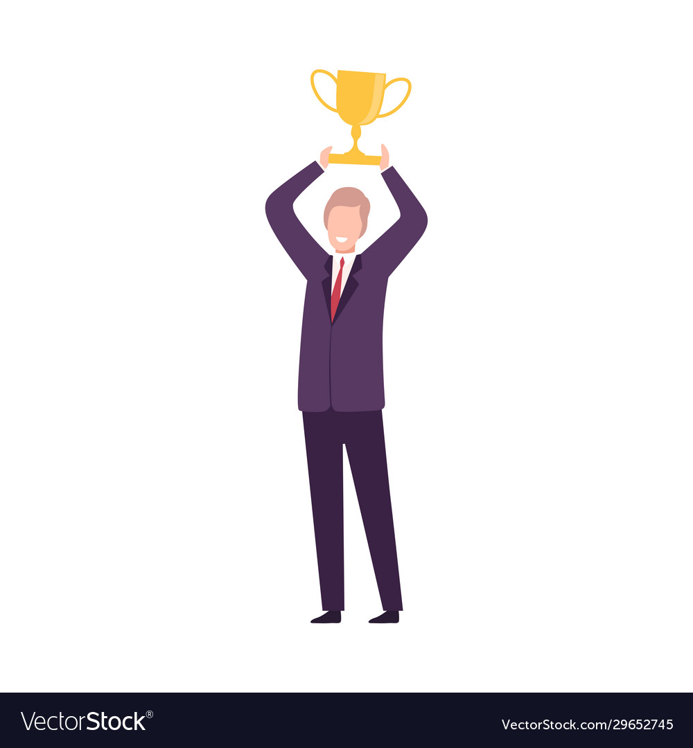 Businessman celebrating victory with trophy cup