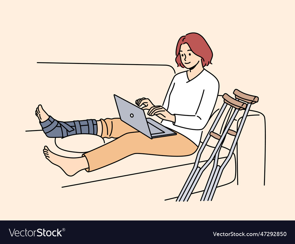 Woman with broken leg work on computer at home