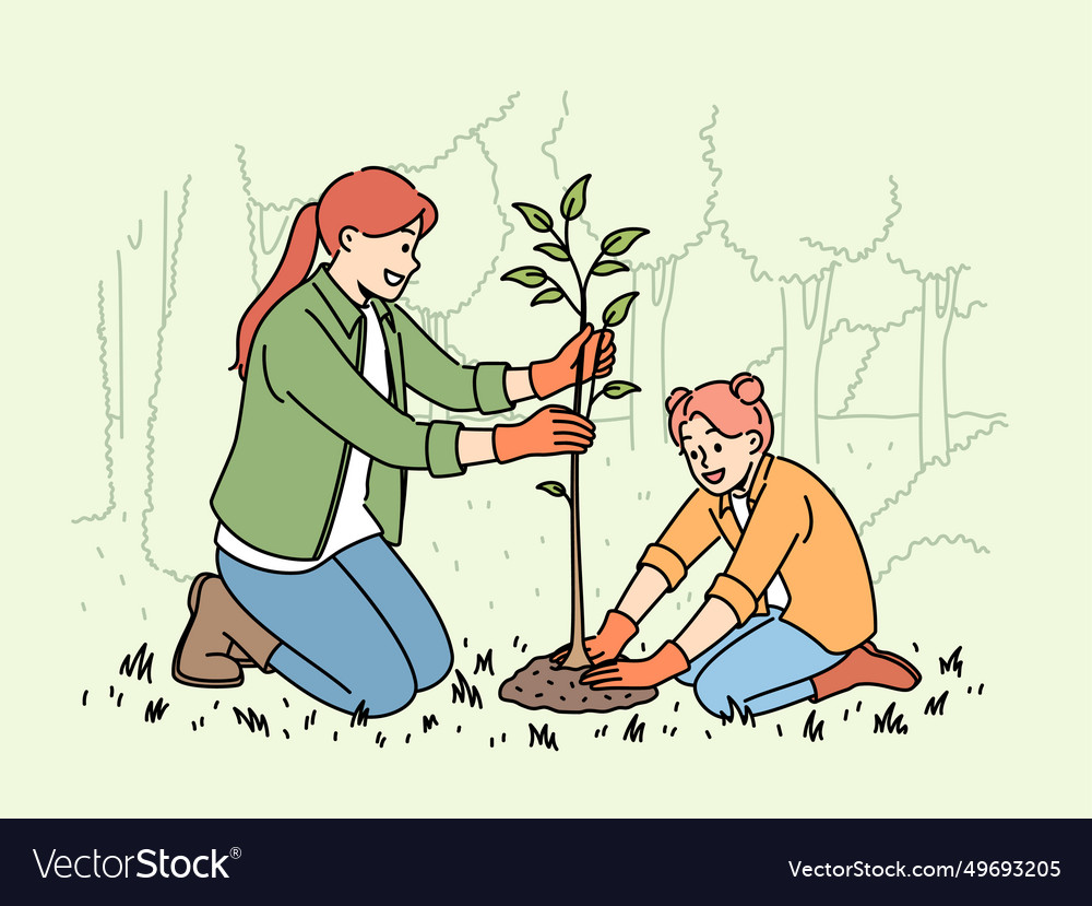 Little girl and mother plant tree in park helping