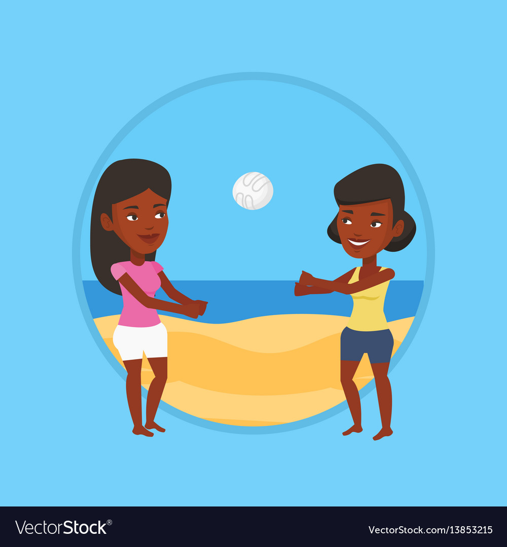 Two women playing beach volleyball