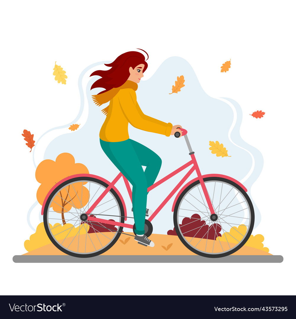 Woman riding bicycle in autumn park