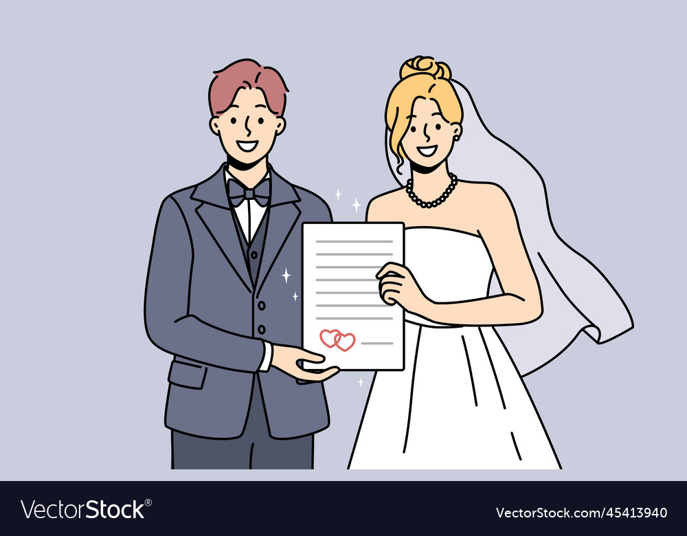 Smiling bride and groom hold marriage certificate