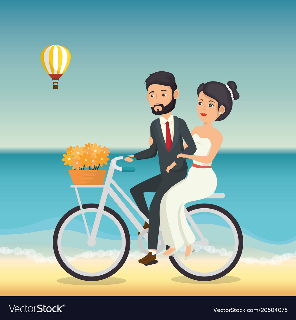 Just married couple in the beach with bicycle