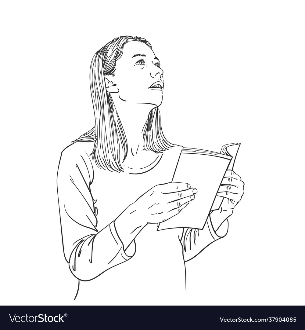 Young woman with open book in hands looks