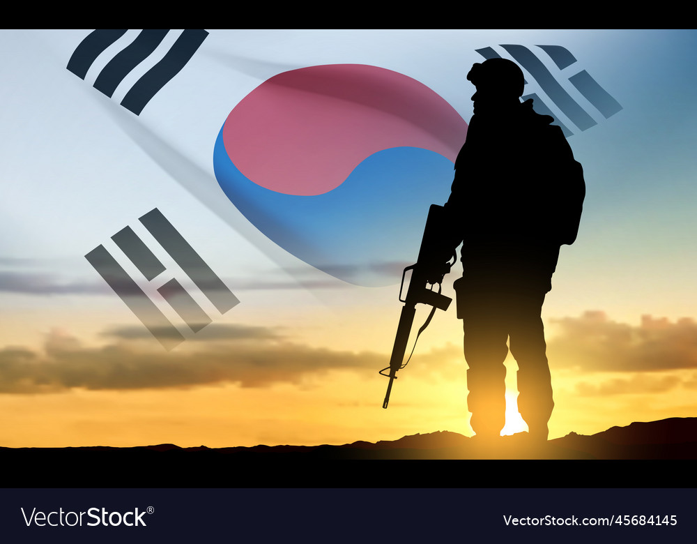 Silhouette of a soldier on background sunrise