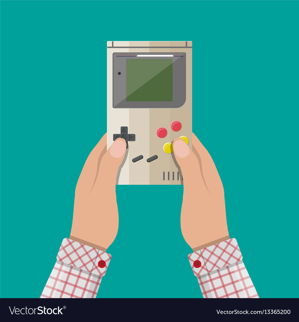Old gadget handheld game console in hands