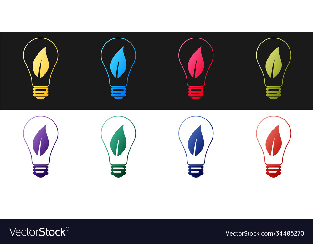 Set light bulb with leaf icon isolated on black