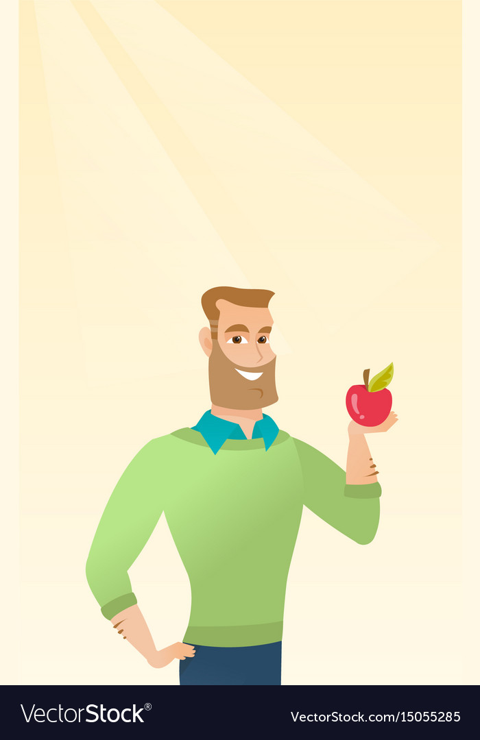 Young man holding an apple