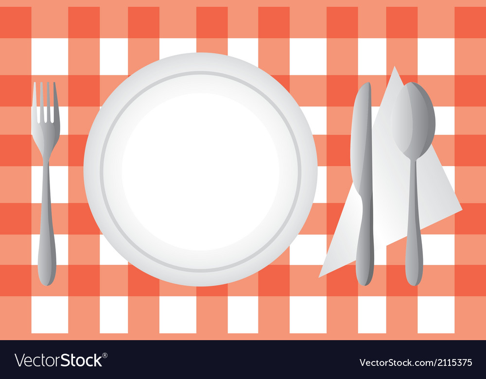 Plate and cutlery over red tablecloth