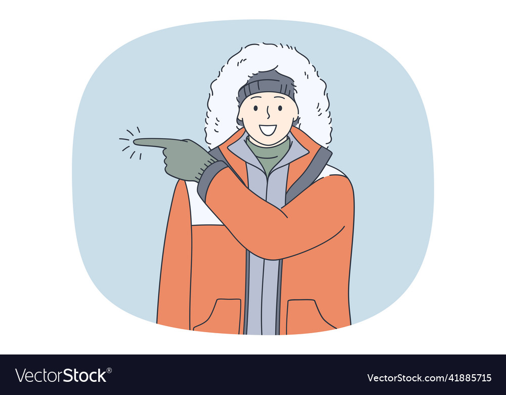 Smiling man in outerwear point direction