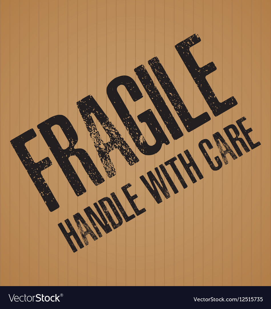 Fragile with handle care on brown cardboard