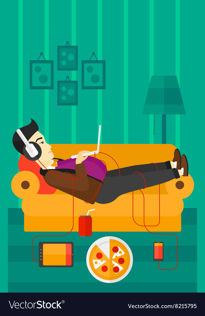 Man lying on sofa with many gadgets