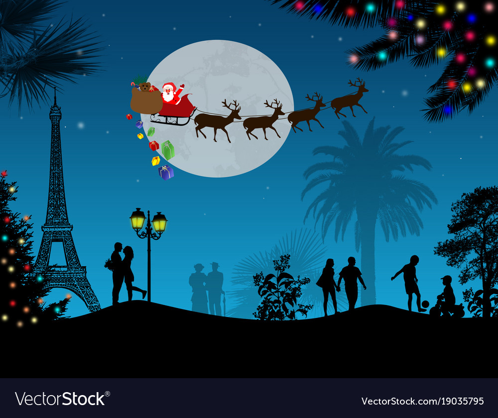 People at night in paris with santa claus