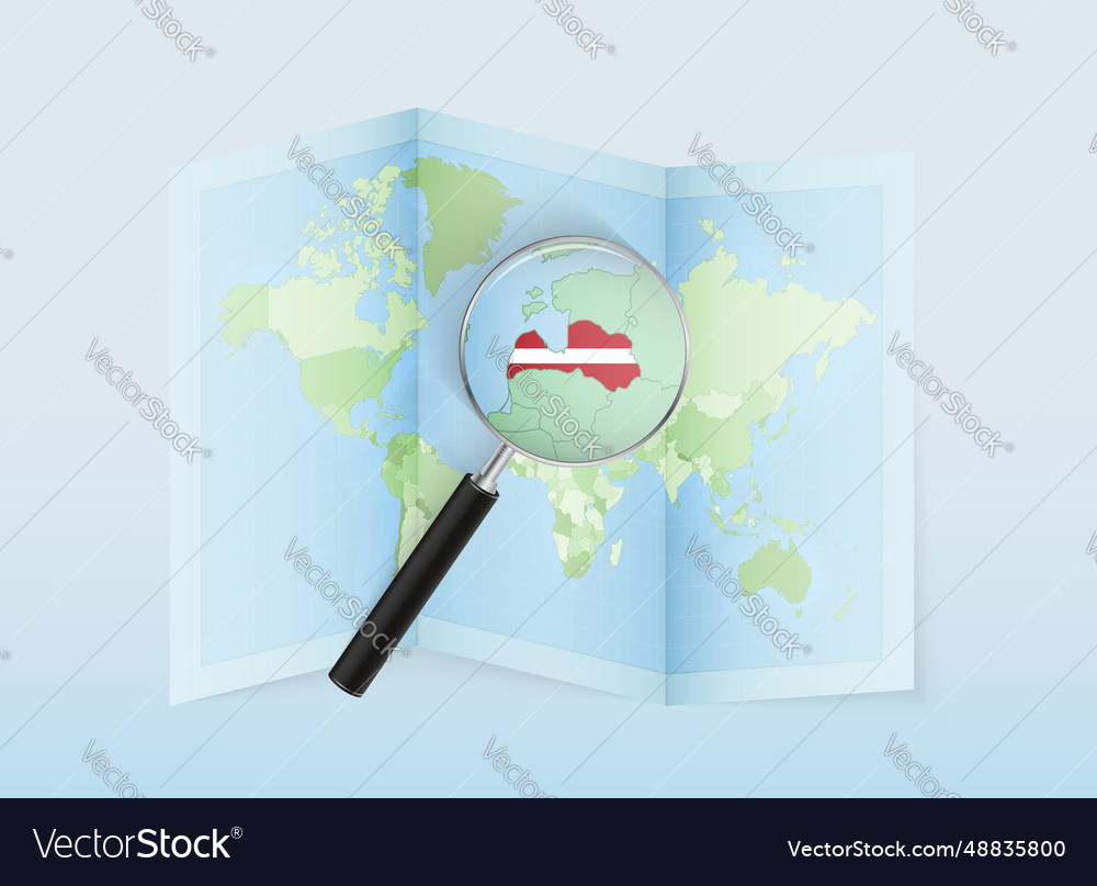 A folded world map with magnifying lens