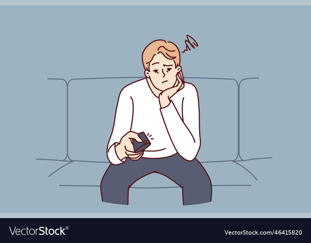 Bored man holding tv remote due to lack