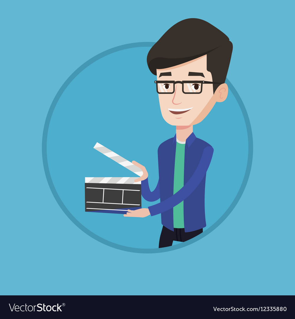 Smiling man holding an open clapperboard