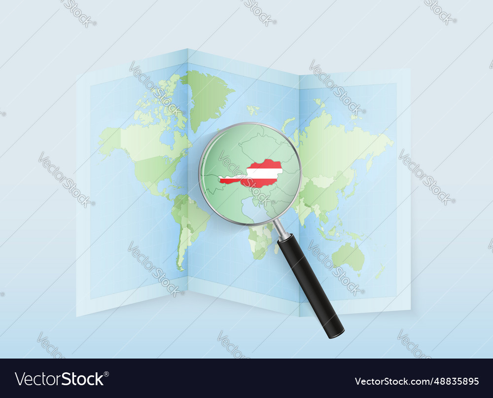 A folded world map with magnifying lens