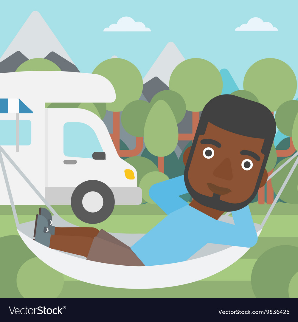 Man lying in hammock front of motor home