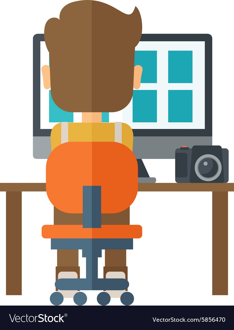 Man with laptop and camera on a table