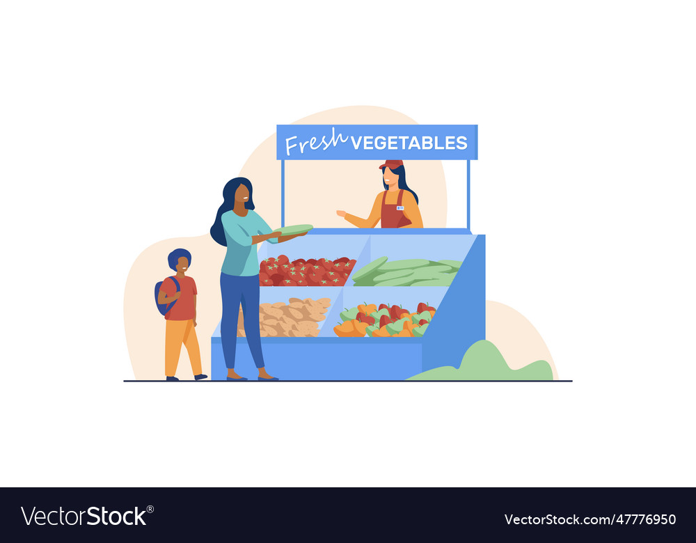 Woman with son choosing fresh vegetables