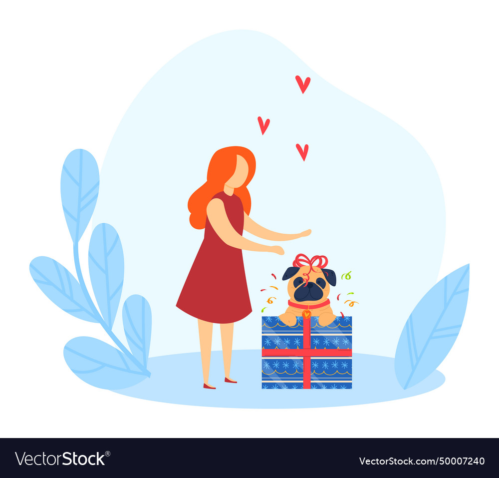 Woman presenting a gift to happy dog sitting