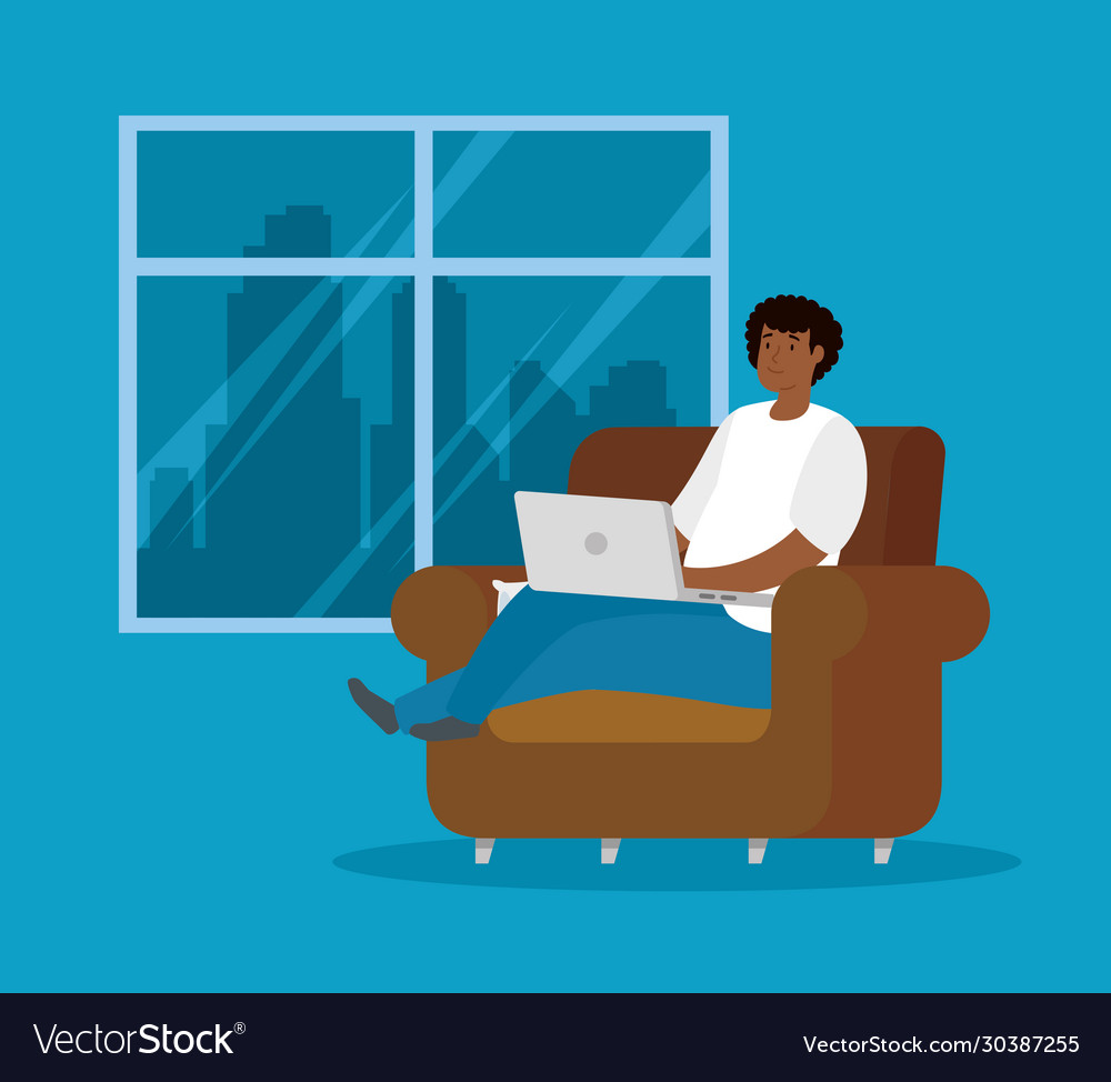 Man afro working at home with laptop sitting