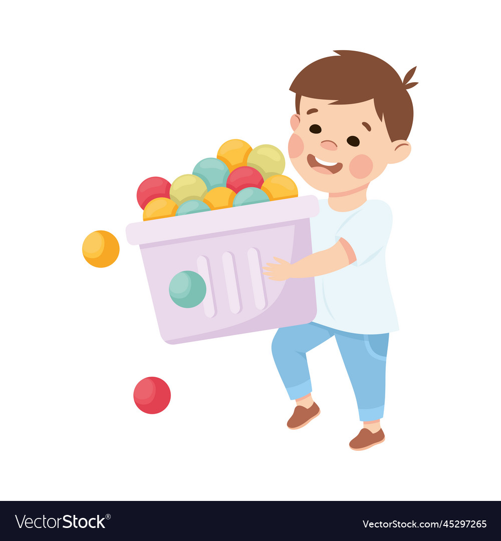 Happy boy carrying box full of toy balls playing