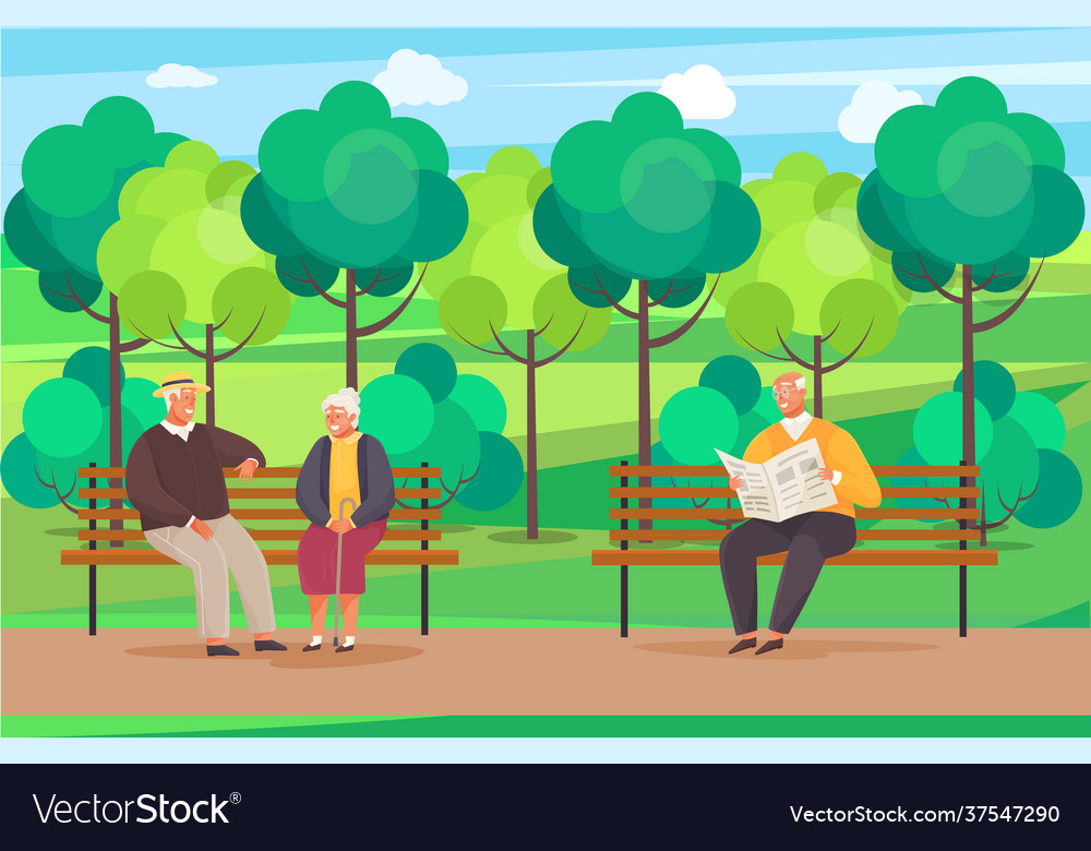 Elderly man sitting on bench in park reading