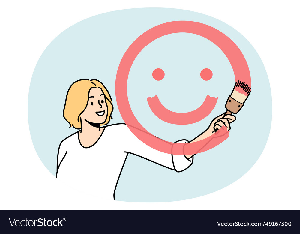 Girl paints smiling face with brush and red paint