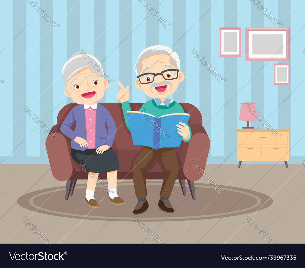 Elderly reading book together on sofa