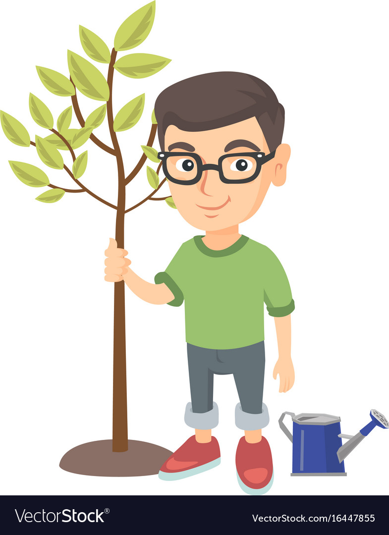 Caucasian smiling boy in glasses planting a tree