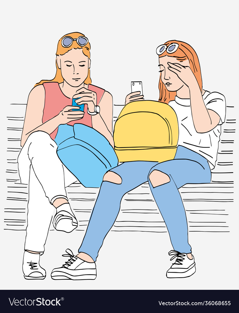 Young city girls sitting on park bench