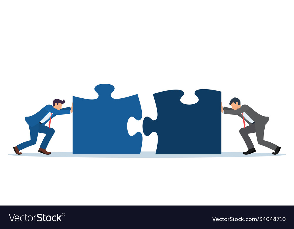 Businessmen pushing two puzzle elements