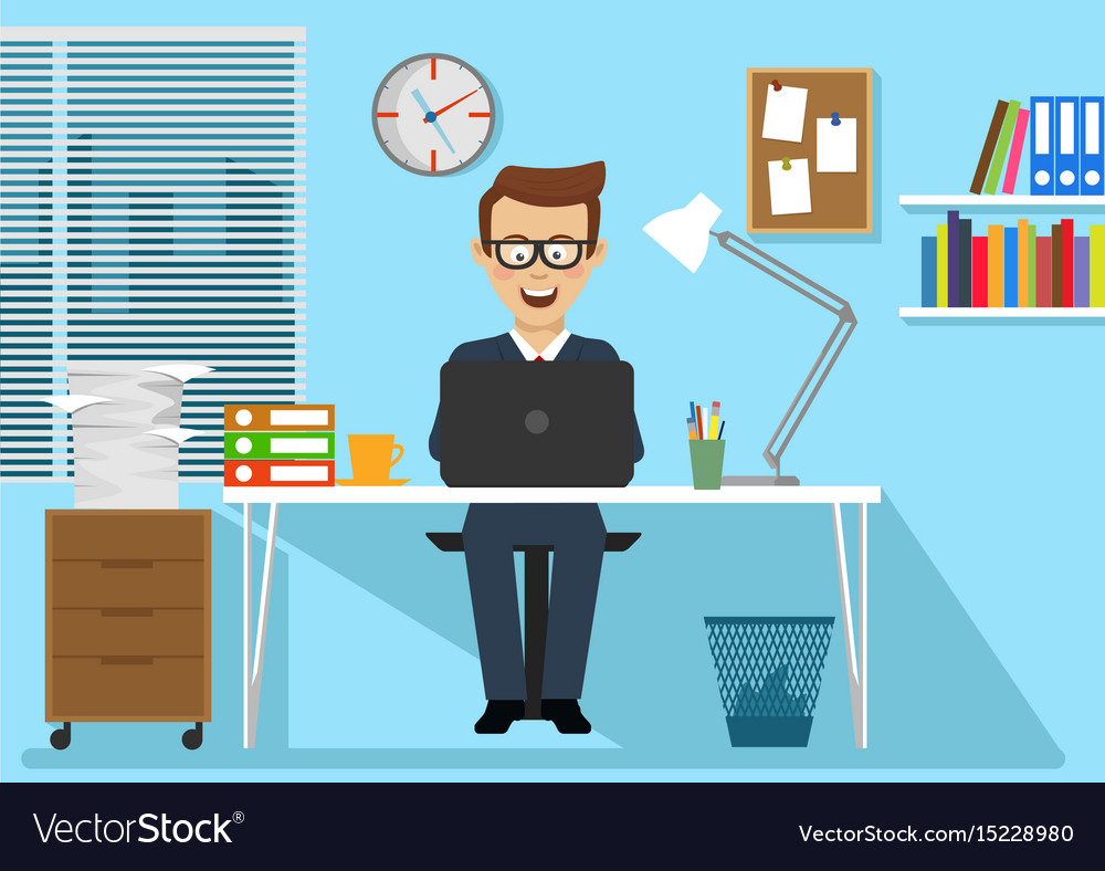 Businessman sitting at office desk with laptop