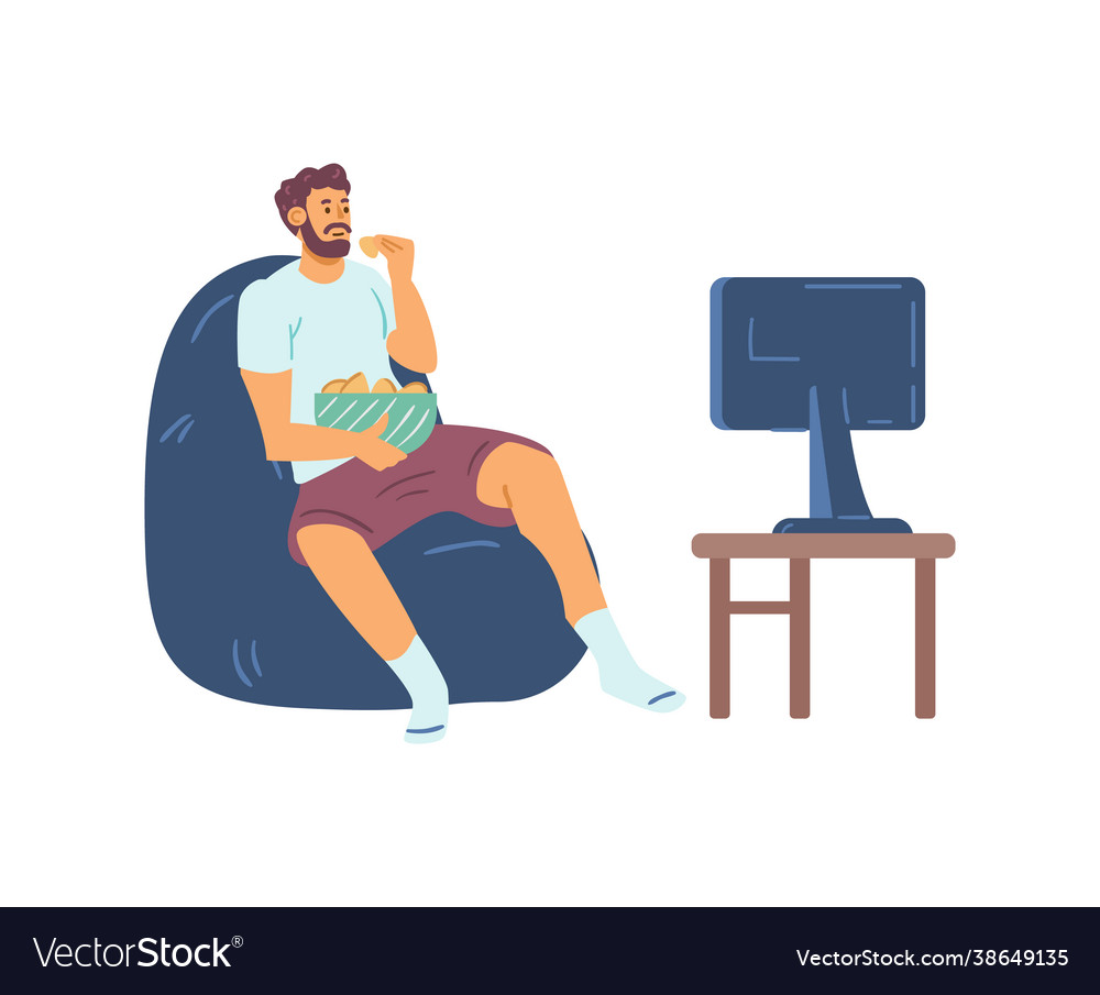 Man in homewear watching tv and snacking at home