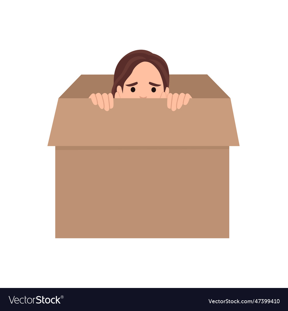 Young woman hiding in a carton box