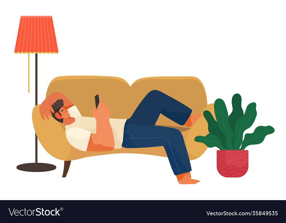 Man lies on couch at home