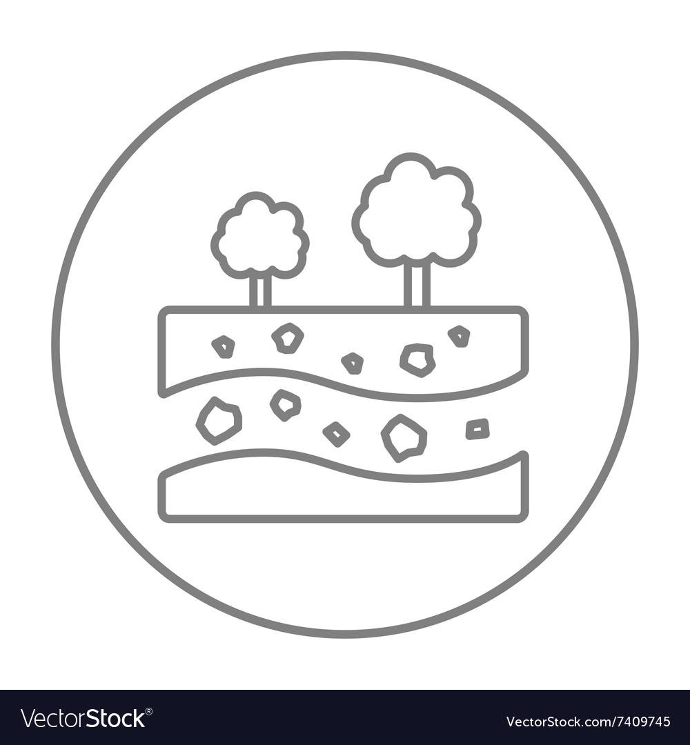 Cut of soil with different layers and trees on top