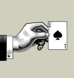 Hand with the ace of spades playing card on the Vector Image