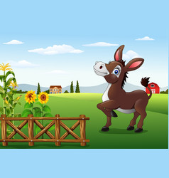 Cartoon happy donkey with farm background Vector Image