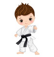 cute little boy practicing karate vector image vector image