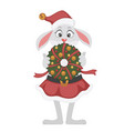 rabbit character holding xmas wreath in hands vector image vector image