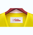 yellow clothes and empty tag on the collar wooden vector image
