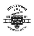 cinema vintage emblem with clapperboard vector image
