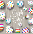 easter eggs on wood background vector image