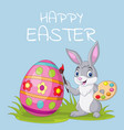 cartoon rabbit painting an easter egg vector image