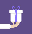 hand holding white gift box donation vector image