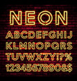bright neon alphabet on dark brick wall background vector image vector image
