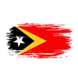 timor-leste flag brush grunge background vector image