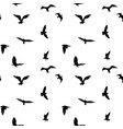 seamless pattern of flying birds silhouettes vector image